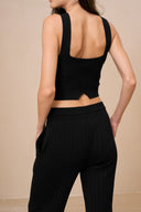 Back view of model wearing wide leg pants in black