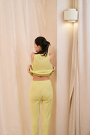 Model wearing ribbed tank in lemon mousse back shot