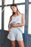 Waistband detail of model wearing grey blue linen set