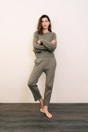 Model wearing tapered pant in sage leaf paired with multi-ribbed pullover