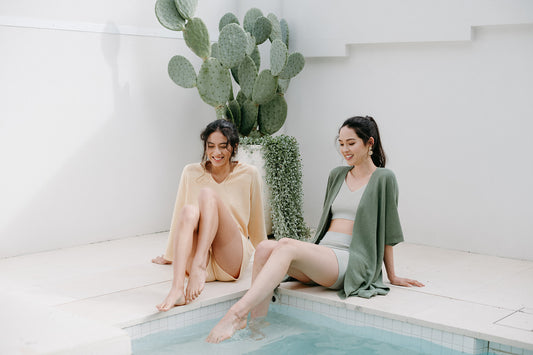 Models Lounging in Polo Pullover and Drawcord Shorts and Bralette, Boyshort and Belted Cardigan