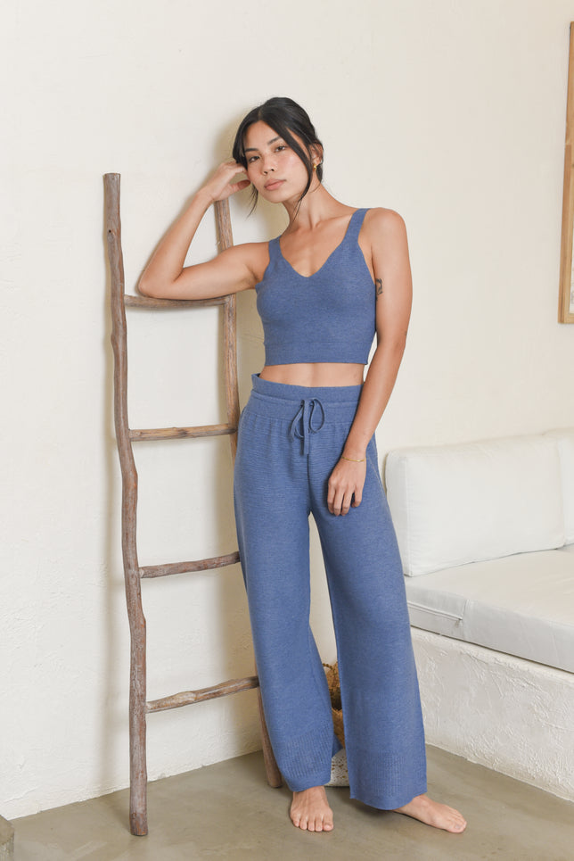 Model wearing blue knit tank top and knit pants