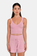 Model wearing cropped tank in Sheer Pink  with matching shorts