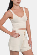 Side view of model wearing cropped tank in Starch with matching shorts 