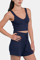 Model wearing cropped tank in Deep Navy  with matching shorts