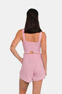 Back view of model wearing cropped tank in Sheer Pink with matching shorts