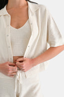 Close up of model wearing cropped shirt in Starch 